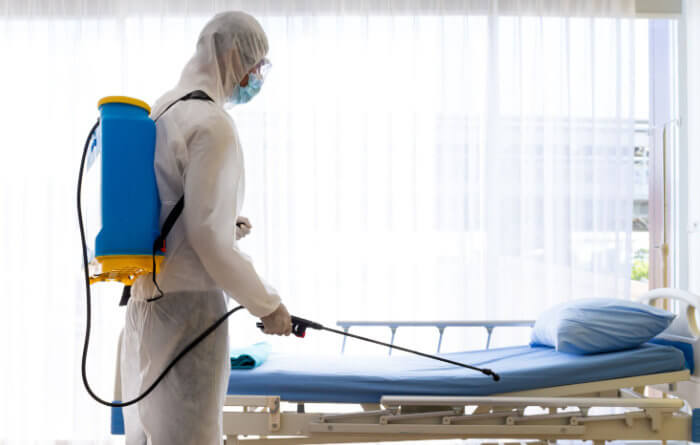 How do you clean an infected patient room in a hospital?