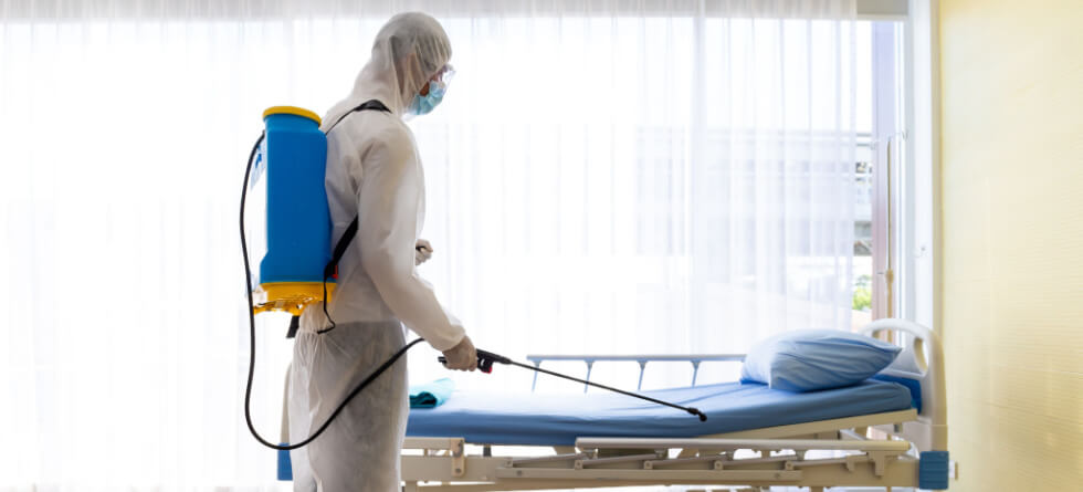 How do you clean an infected patient room in a hospital?